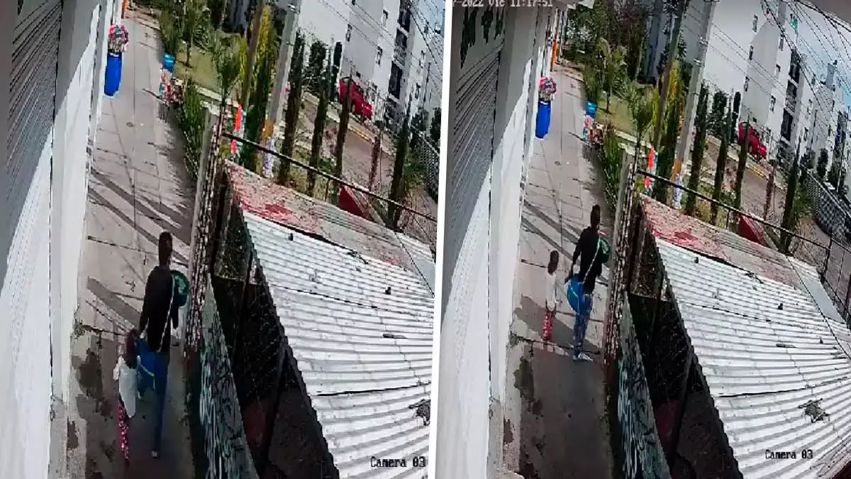 Hombre caminando con una niña de la mano en calles de la colonia Bosques de San Sebastián.