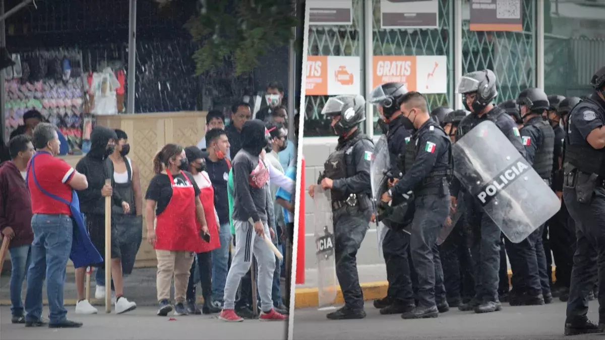 En operativo, comerciantes del Mercado Hidalgo golpean a policías.