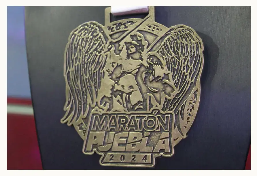 Playera y medalla del Maratón Puebla 2024 están inspiradas en el arte barroco y ángeles